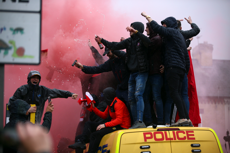 Illustration for article titled Liverpool Fans Get Rowdy, Hop On Police Vans